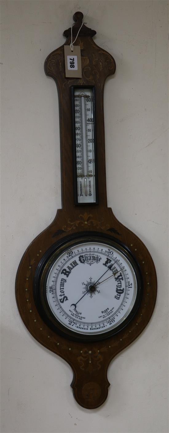 An inlaid aneroid barometer W.31.5cm